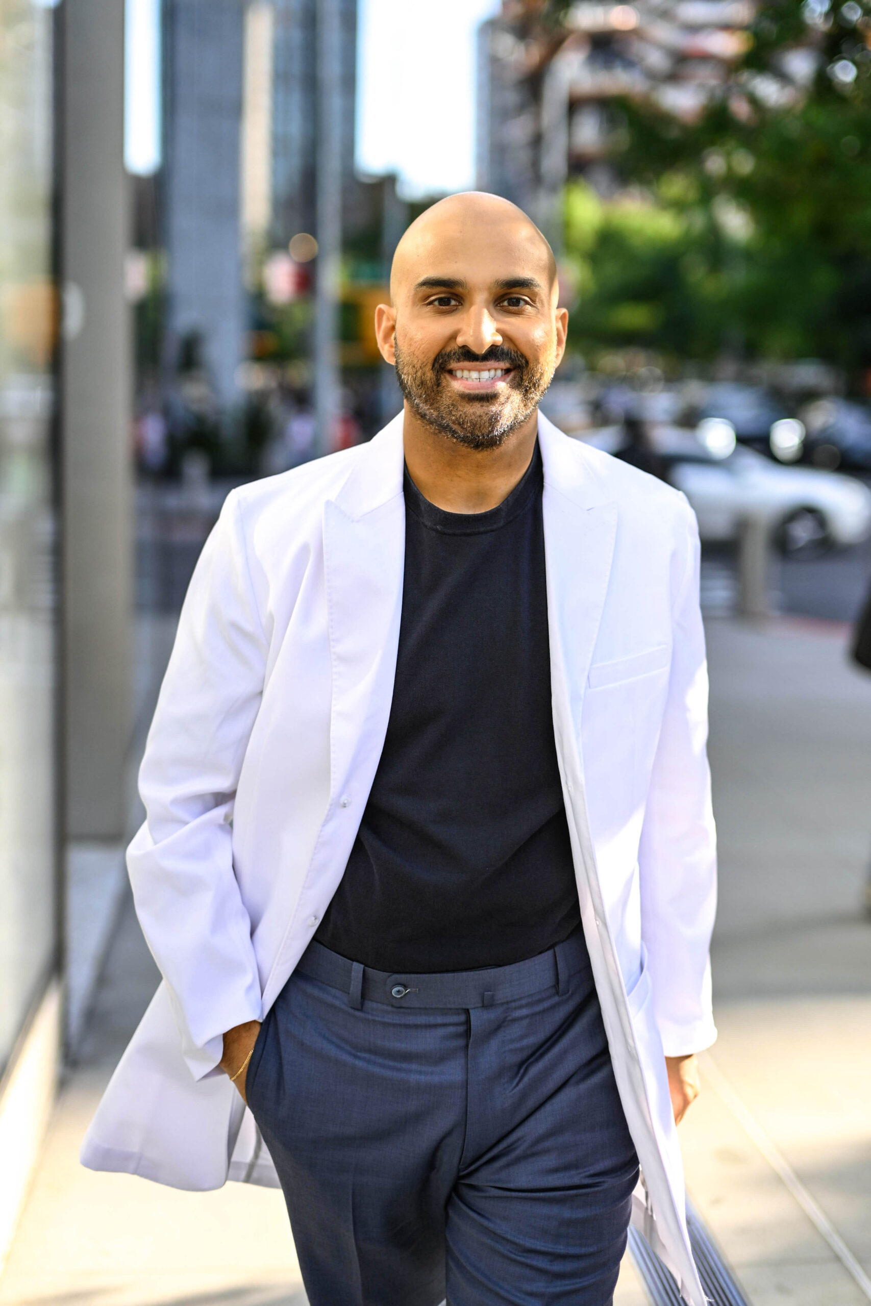 Dr. Rishi chopra walking in New York City to his new work place at Hudson Dermatology and Laser Surgery